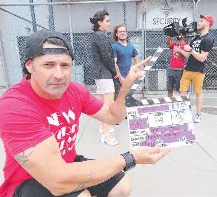  ?? Picture: GLENN HAMPSON ?? A film production hot set will be installed at Warner Bros. Movie World for New York Film Academy Australia students to film on a real set employing industry-standard equipment. Ian MacLachlan gets a scene rolling.