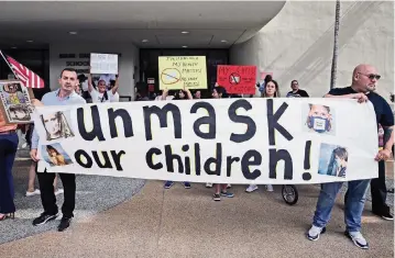  ?? CHARLES TRAINOR JR. ctrainor@miamiheral­d.com ?? Protesters rally at the Miami-Dade School Board building on May 19.