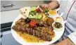  ??  ?? A Mediterran­ean platter from Beirut Grill and Kebab.