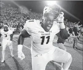  ?? Michael Shroyer Getty Images ?? OLD DOMINION defensive tackle Miles Fox celebrates after the Monarchs, who were more than four-touchdown underdogs, stunned No. 13 Virginia Tech 49-35.