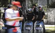  ?? MARCELO ENDELLI / GETTY IMAGES ?? Riot police stand guard outside of Monumental Stadium in Buenos Aires, Argentina.