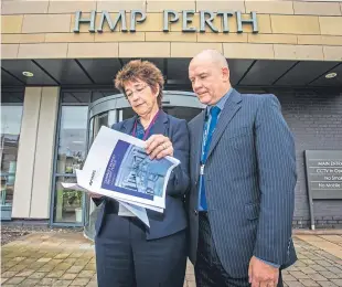  ?? Picture: Steve MacDougall. ?? HM chief inspector of prisons, Wendy Sinclair-Gieben, and Fraser Munro, governor of Perth Prison, examine the report.