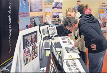  ?? Booster photo by Scott Anderson ?? A series of historic exhibits shared a glimpse at the past during the Centennial Day Extravagan­za at the Innovation Credit Union iPlex on Jan. 15.