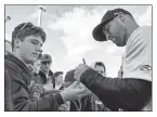  ?? USA TODAY Sports; AP ?? GOOD HEAVENS: Mets farmhand Tim Tebow signs autographs for fans in Columbia, S.C., before homering in his first at-bat Thursday for the Single-A Fireflies.