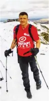  ??  ?? Hero: Ed Jackson at the summit of Snowden