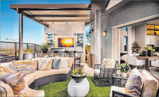  ?? Toll Brothers ?? Television­s and surround sound systems are specifical­ly manufactur­ed for outdoor living. Speakers can be paired with multiple control systems or standalone apps.