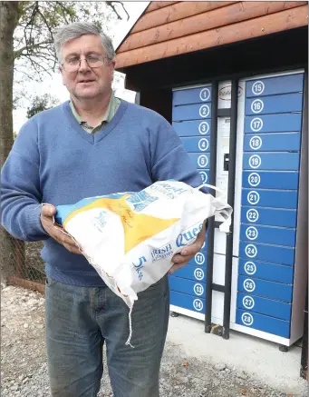  ??  ?? Gerry Finnegan sells his potatoes from a vending maching on Sheetland Road, Termonfeck­in.