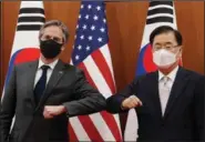  ?? (AP/Lee Jin-man) ?? U.S. Secretary of State Antony Blinken (left) and South Korean Foreign Minister Chung Eui-yong join elbows in front of the media Wednesday before their meeting at the Foreign Ministry in Seoul.