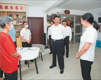 ?? XIE HUANCHI / XINHUA ?? President Xi Jinping talks on June 28 with community workers, Party members and volunteers during an inspection tour of Wuhan, the capital of Hubei province, and hears about local efforts in the prevention and control of COVID-19 outbreaks.