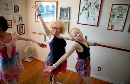  ?? PHOTO: LA TIMES ?? Bibiana Mashamba, left, and her younger sister Tindi, right, take a ballet lesson with Liz Cantine, far left, in Palos Verdes, California. The sisters have been granted asylum to stay in the US.