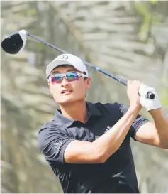  ??  ?? Li Haotong of China plays a shot during day three of the Dubai Desert Classic at Emirates Golf Club in Dubai in this Jan 27 file photo. — AFP photo