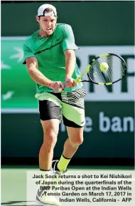  ??  ?? Jack Sock returns a shot to Kei Nishikori of Japan during the quarterfin­als of the BNP Paribas Open at the Indian Wells Tennis Garden on March 17, 2017 in Indian Wells, California - AFP