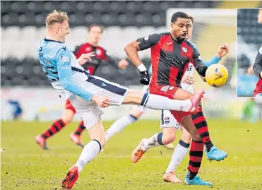  ??  ?? All eyes were on the prize for St Mirren’s Jon Obika and Ross County’s Coll Donaldson