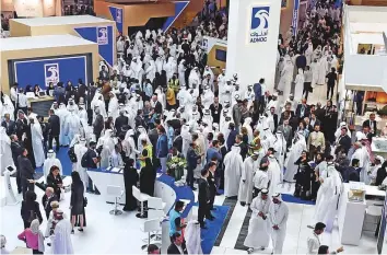  ?? Abdul Rahman/Gulf News ?? Delegates and visitors tour the Adnoc pavilion during the last day of Adipec yesterday.