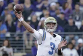  ?? ELAINE THOMPSON — ASSOCIATED PRESS ?? UCLA quarterbac­k Josh Rosen throws against Washington during the first half Oct. 28 in Seattle.