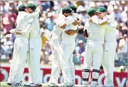  ?? EPA ?? Australian team celebrate their victory over India in the third Test at the WACA ground in Perth yesterday.