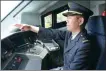  ?? PROVIDED TO CHINA DAILY ?? Losong Tsering sits at the control panel of a high-speed train.