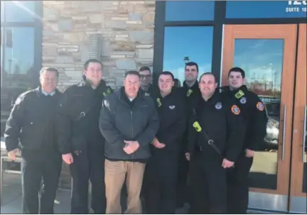  ?? SUBMITTED PHOTO ?? Habit Burger Grill district manager Russ Caratenuto, third from left, with Upper Merion Fire Chief Dennis Rubin, far left, and Upper Merion firefighte­rs.