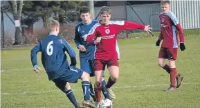  ??  ?? More action from Dryburgh U/16’s (red) league tie with Dundee Thistle at the weekend.