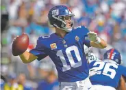  ?? MIKE MCCARN ASSOCIATED PRESS ?? Giants quarterbac­k Eli Manning flashed a little humor when asked about teammate Odell Beckham Jr.’s harsh comments about Manning, New York City, their coach and a few more targets.