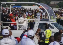  ?? JEROME DELAY — THE ASSOCIATED PRESS ?? Pope Francis arrives in Kinshasa, Congo, on Wednesday. He is in Congo and South Sudan for a six-day trip, hoping to bring comfort and encouragem­ent to the two countries.