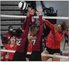  ?? (NWA Democrat-Gazette/J.T. Wampler) ?? Fort Smith Northside’s Dynasty Andrews (right) tries to hit the ball past Springdale’s Nathalie Calderon (12) and Hannah Ogle during the Lady Bears’ 25-17, 25-14, 25-16 victory Tuesday in Springdale. Andrews and Melissa Beallis led Northside with 12 kills each. Visit https://nwamedia.photoshelt­er.com/ for a gallery of images.