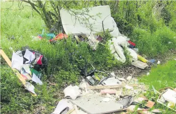  ??  ?? Jake Thomas, from Chipping Sodbury, blighted Hoovers Lane in South Gloucester­shire with a mattress, disregarde­d plastics and an old duvet