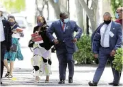  ?? /Esa Alexander ?? Finance minister Tito Mboweni arrives with his entourage at parliament ahead of his 2021 budget speech.