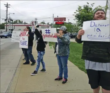  ?? LISA CORNWELL — THE ASSOCIATED PRESS ?? Parents and other demonstrat­ors hold signs against bullying and in memory of Gabriel Taye, an 8-year-old boy who killed himself in January 2017 two days after being knocked unconsciou­s by another Carson School student, on Friday outside the elementary...