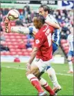  ??  ?? LEG UP: Chris O’Grady and Inigo Calderon tangle