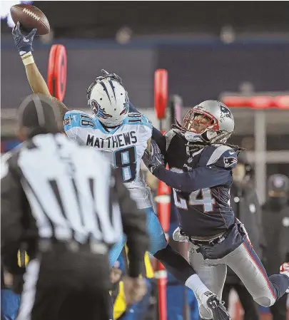  ?? STAFF PHOTO BY MATT STONE ?? IN YOUR FACE: Patriots cornerback Stephon Gilmore (24) keeps tight coverage on an incomplete pass intended for Titans receiver Rishard Matthews during the fourth quarter last night in Foxboro.