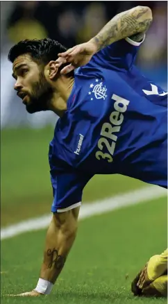  ??  ?? Daniel Candeias stumbles over Santiago Caseres, before