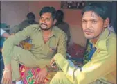  ?? HT PHOTOS ?? (Left) A teacher distributi­ng prashad at one of the temples during the Kapal Mochan Mela in Yamunanaga­r; safai karamchari­s (in khaki) tasked with loading offerings in trucks.