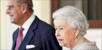  ?? Stefan Wermuth / Associated Press ?? Britain’s Queen Elizabeth II and Prince Philip received their COVID-19 vaccinatio­ns on Saturday, joining 1.5 million people in Britain who have been given the first dose.