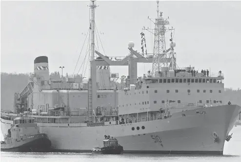  ?? ANDREW VAUGHAN / THE CANADIAN PRESS ?? HMCS Preserver, one of Canada’s operationa­l support ships, designed to carry large amounts of fuel, provisions, and dry stores during naval operations, is pushed by tugs in Halifax harbour in October 2011. Its name, and that of HMCS Protecteur, will...