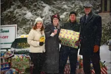  ?? PHILIP COLTART PHOTO ?? Skidmore College employees present President Philip A. Glotzbach with donations gathered for the 14th annual Skidmore Cares community service program.