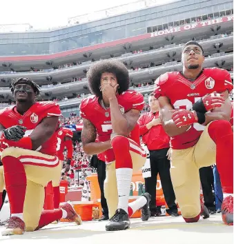  ?? ASSOCIATED PRESS/MARCIO JOSE SANCHEZ ?? San Francisco 49ers, from left, Eli Harold, Colin Kaepernick and Eric Reid kneel in protest during the national anthem before a game against Dallas in October 2016.