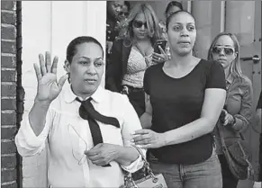  ??  ?? Leandra Feliz, left, the mother of Lesandro, leaves her apartment for her son’s wake Monday. (Photo: New York Daily News)