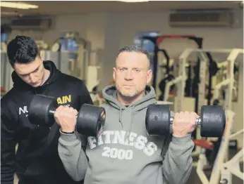  ??  ?? Mental health wellbeing through exercise at Fitness 2000 with client Chris Batty and PT Matty Watson