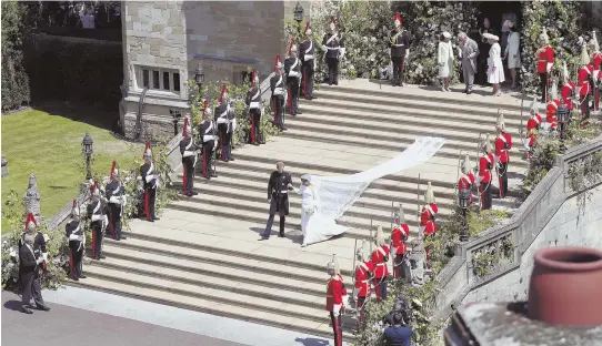  ??  ?? CEREMONY SCENES: Prince Harry pulls back the veil of Meghan Markle, top left, as Archbishop of Canterbury Justin Welby looks on; the couple depart St. George’s Chapel, left; and Queen Elizabeth II looks on during the ceremony.