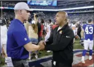  ?? BILL KOSTROUN — THE ASSOCIATED PRESS ?? New York Giants’ Pat Shurmur, left, and Cleveland Browns’ Hue Jackson shake hands after Thursday’s preseason game in East Rutherford, N.J.