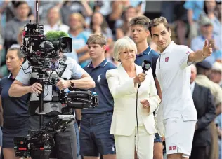  ??  ?? Crown jewel: Sue Barker interviews Roger Federer after his Wimbledon final defeat last year