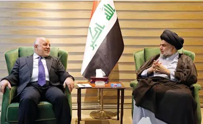  ?? AFP ?? Iraqi Prime Minister Haider Al Abadi meets Muqtada Al Sadr in the Green Zone in Baghdad on Sunday. —