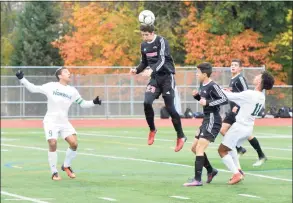  ?? Hearst Connecticu­t Media file photo ?? Fairfield Warde’s No. 23 Sean Rodriguez gets to the ball first during Class LL boys soccer action vs. Norwalk in 2017 at Norwalk High School.