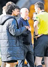  ?? ?? Words David Martindale confronts ref Kevin Clancy at full time. Picture: Rob Casey / SNS Group