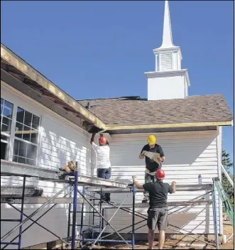  ?? lyNN CurwiN/ Truro Daily News ?? (LEFT) The most noticeable change for people driving past the Seventh-day Adventist Church is the addition of a steeple. Volunteers have been doing much of the work.