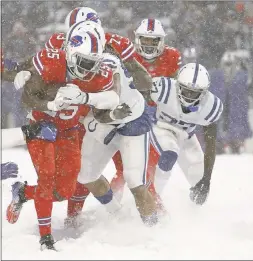  ?? JEFFREY T. BARNES —ASSOCIATED PRESS ?? Bills running back LeSean McCoy runs through the snow for a chunk of his 156 yards.