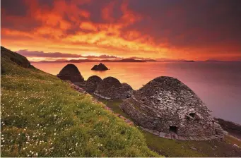  ??  ?? Sunrise at the beehive huts on Skellig Michael.