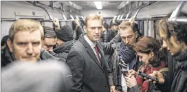  ?? EVGENY FELDMAN / NAVALNY CAMPAIGN ?? Russian opposition leader Alexei Navalny rides the subway on his way to attend a meeting Monday of the Central Election Commission in Moscow. Navalny was barred from a presidenti­al run over his fraud conviction­s.