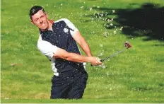  ?? AP ?? Europe’s Rory McIlroy plays out a bunker on the third green during a practice round for the 2018 Ryder Cup in SaintQuent­in-en-Yvelines, outside Paris, yesterday.